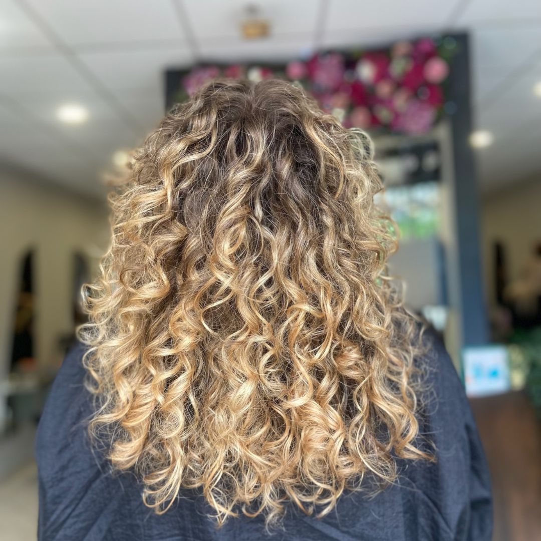 CURLY HAIR HIGH WYCOMBE Professional curly haircut and styling at The Cutting Studio High Wycombe enhancing natural texture with shape, volume, and softness.